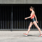 Slim,Sporty,Young,Girl,Walking,On,Street