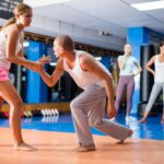 Young,Woman,Practicing,Basic,Self-defense,Techniques,While,Training,In,Gym